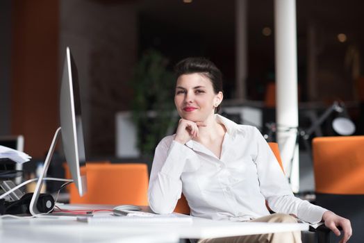 happy young business woman relaxing and geting insiration while working on desktop computer at modern bright  starup office interior