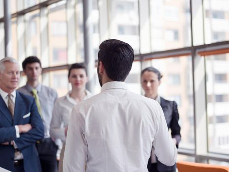 business leader working with his team, making presentation and brainstorming about ideas and projects at office