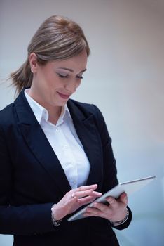 corporate business woman working on tablet computer  at modern office interior