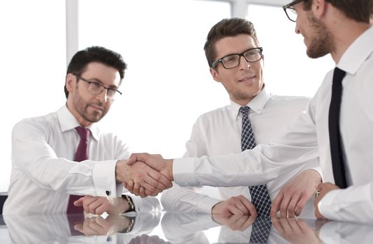 employees greet each other with a handshake.business concept