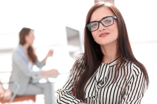 attractive business woman on the background of the office .photo with copy space