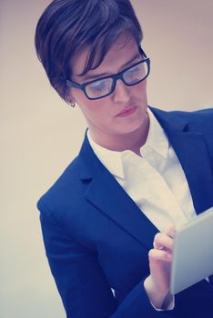 corporate business woman working on tablet computer  at modern office interior