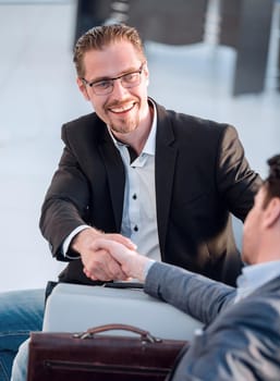 close up. handshake of business people on blurred background