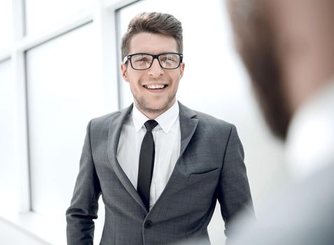 young employee standing in the office.photo with copy space