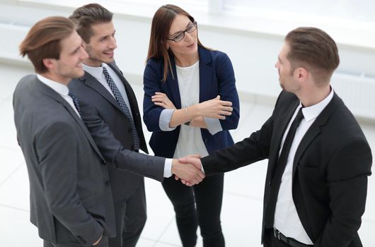 Business team greeting each other at the office