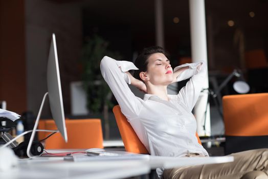 happy young business woman relaxing and geting insiration while working on desktop computer at modern bright  starup office interior