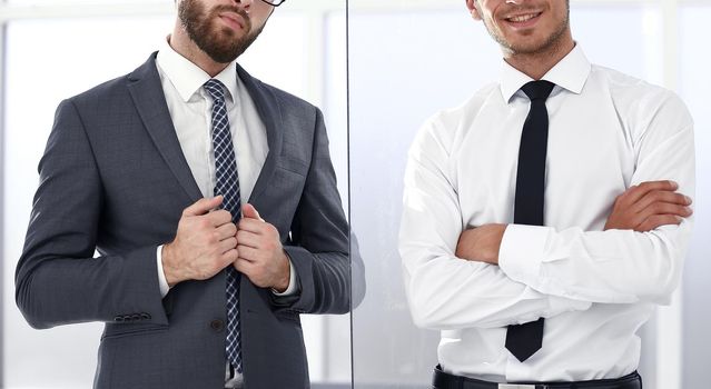 two business people standing in the office .business concept