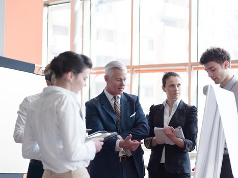 business leader working with his team, making presentation and brainstorming about ideas and projects at office