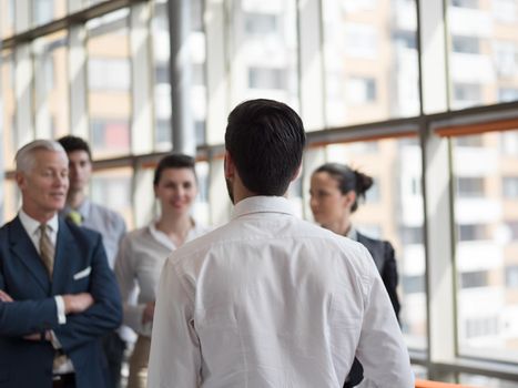 business leader working with his team, making presentation and brainstorming about ideas and projects at office