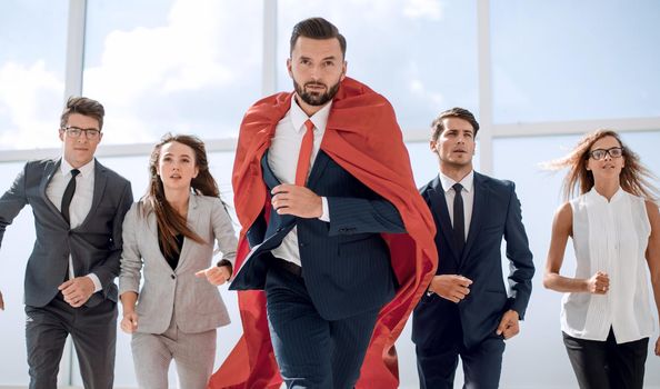 businessman superhero and his business team are stepping together.photo with copy space