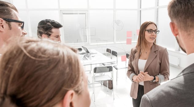 business woman talking to business partners in her office.photo with copy space