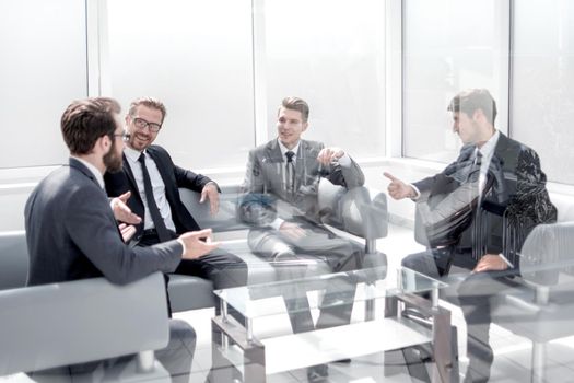 business people talk, sitting in the lobby of the business center.photo with copy space