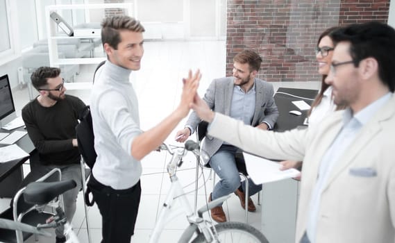 day without a car.business colleagues giving each other a high five.office weekdays