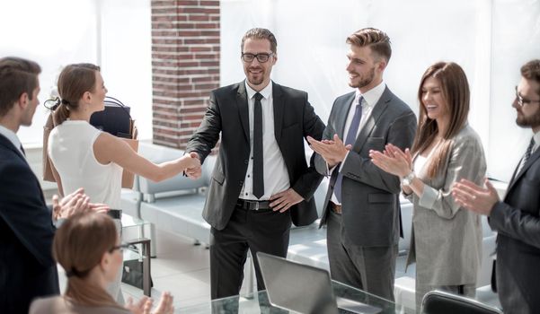 handshake of a young employee with the project Manager.business concept