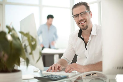 portrait of business man on blurred office background.photo with copy space