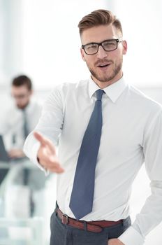 close up.business man holding out his hand for a handshake