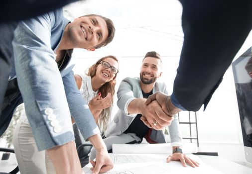 close up.businessman and architect shaking hands .the concept of successful cooperation