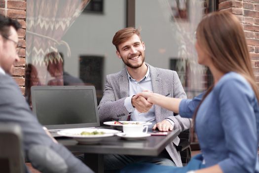 business partners greet each other in the cafe. concept of partnership