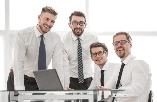 professional business team standing near the desktop. the concept of teamwork
