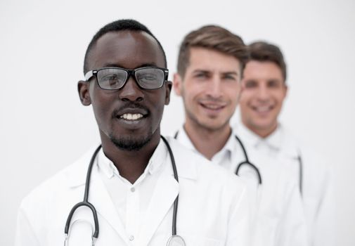 group of multi-racial doctors standing in a row.the concept of professionalism