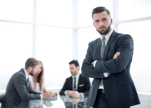 modern businessman standing in a bright office.photo with copy space