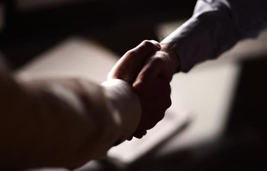 close up.handshake of two business people.business background