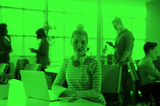 Young female Entrepreneur Freelancer Working Using A Laptop In Coworking space