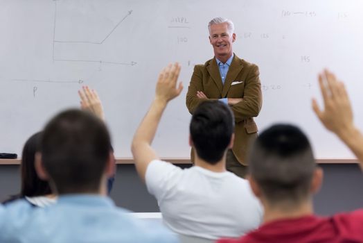 group of students study with professor in modern school classroom