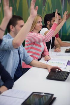 teacher teaching lessons, smart students group raise hands up in school  classroom