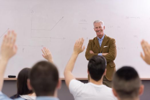 group of students study with professor in modern school classroom