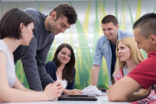 students group study together in school classroom and working together homework project