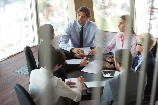 top view of  business people group on meeting, working in modern bright office indoor with tablet computer