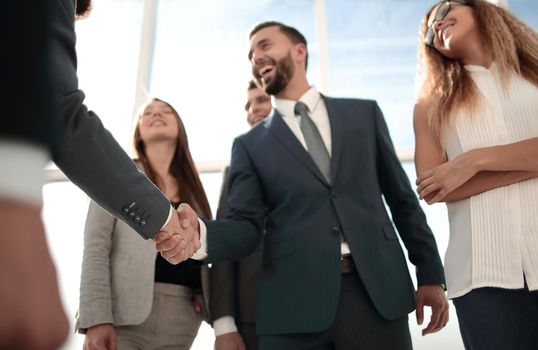 business partners greeting each other with a handshake.business concept