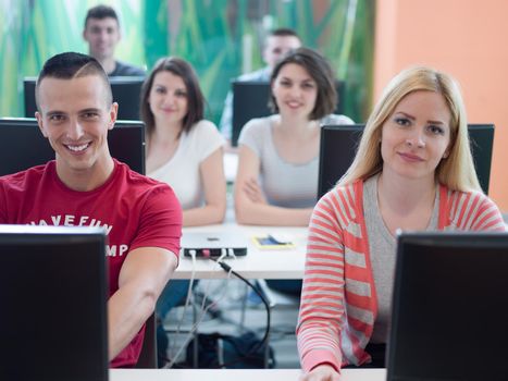 technology students group in computer lab school  classroom working on