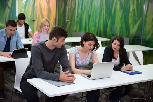 students group study together in school classroom and working together homework project