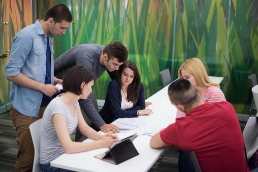 students group study together in school classroom and working together homework project