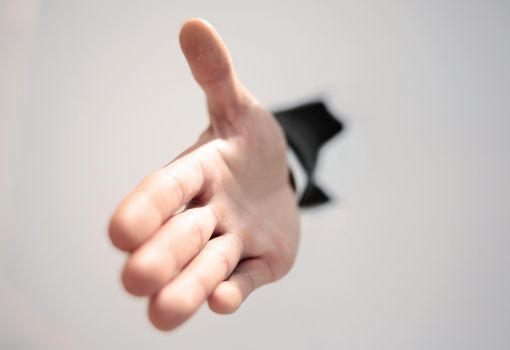 close up. businessman holding out his hand for a handshake.photo with copy space