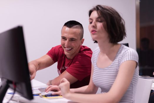 technology students group in computer lab school  classroom working on