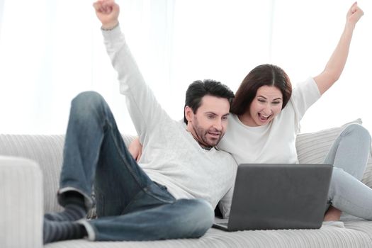 young couple is rooting for their favorite team .people and technology