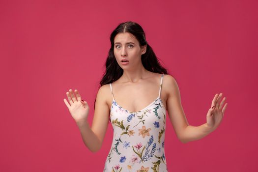 Image of excited screaming young woman on the pink background