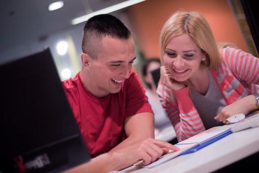 technology students group in computer lab school  classroom working on