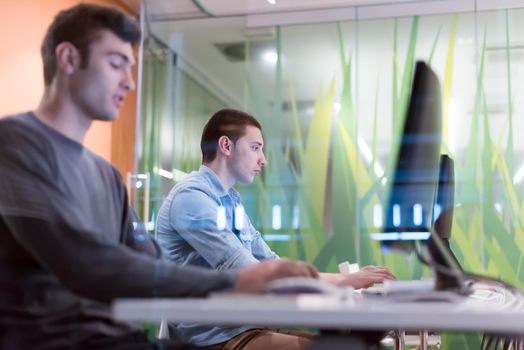 technology students group in computer lab school  classroom working on