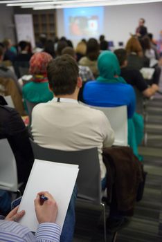 young business people taking notes on education training conference seminar, students at modern classroom