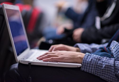 business people hands typing on laptop computer keyboard during the seminar at conference room