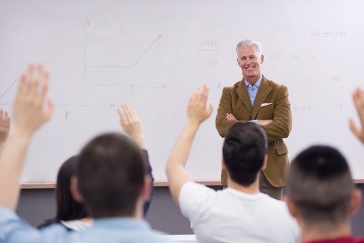 group of students study with professor in modern school classroom