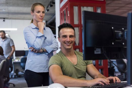 business couple working together on project at modern startup office