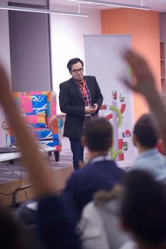 speaker on education conference presentation at modern startup interior