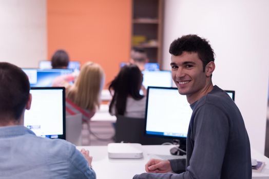 technology students group in computer lab school  classroom working on