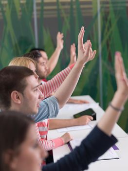 senior teacher teaching lessons, smart students group raise hands up in school  classroom on class