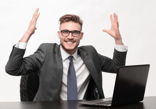 happy businessman sitting at his Desk.photo with copy space